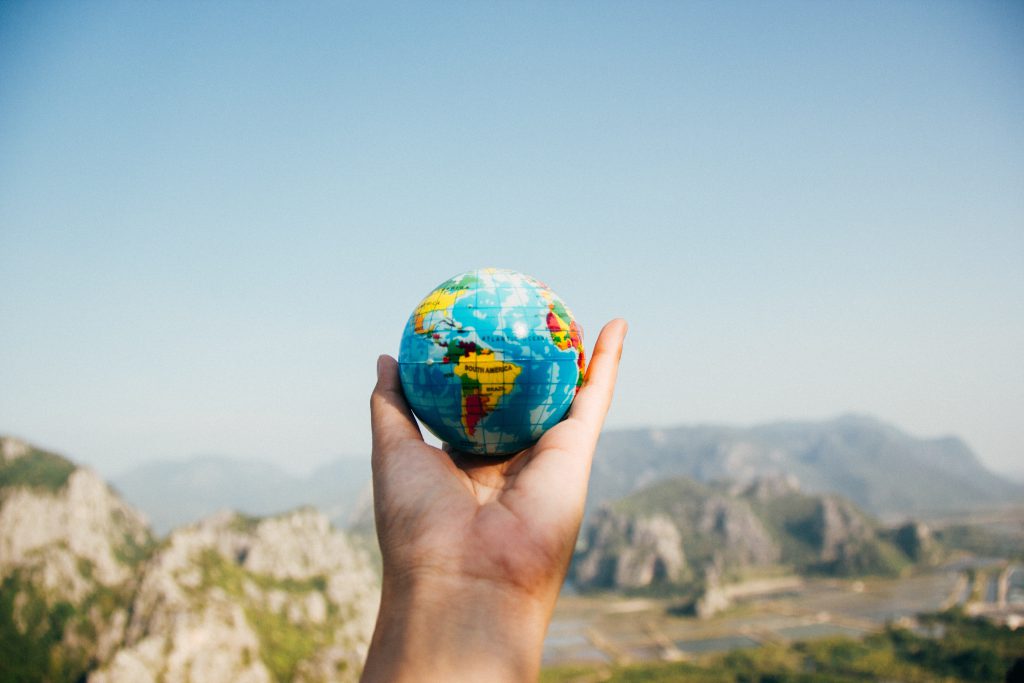 a globe in hand